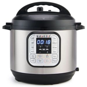 Digital pressure cooker with electronic control panel and multiple cooking options for quick meal preparation.